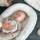Babynest din bumbac organic Doomoo Cocoon Leaves Aqua Green