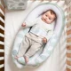 Babynest din bumbac organic Doomoo Cocoon Leaves Aqua Green