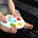 Сенсорная игрушка Baby Einstein Color Popper Palette