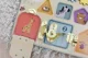Интерактивная игрушка Tooky Toy Busyboard Doors and Gears foto