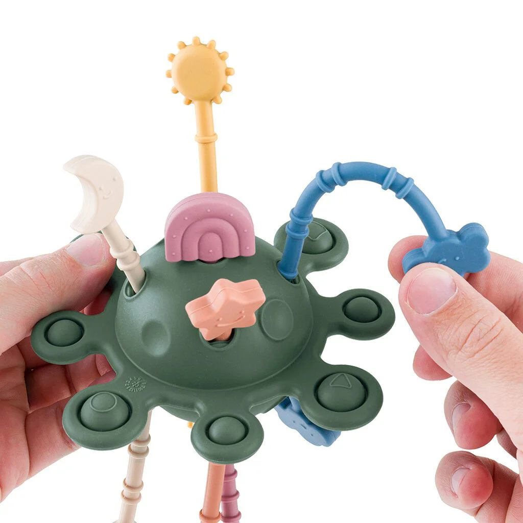 Jucarie senzoriala din silicon Petite&Mars Crazy Planet Misty Green (10+ luni)