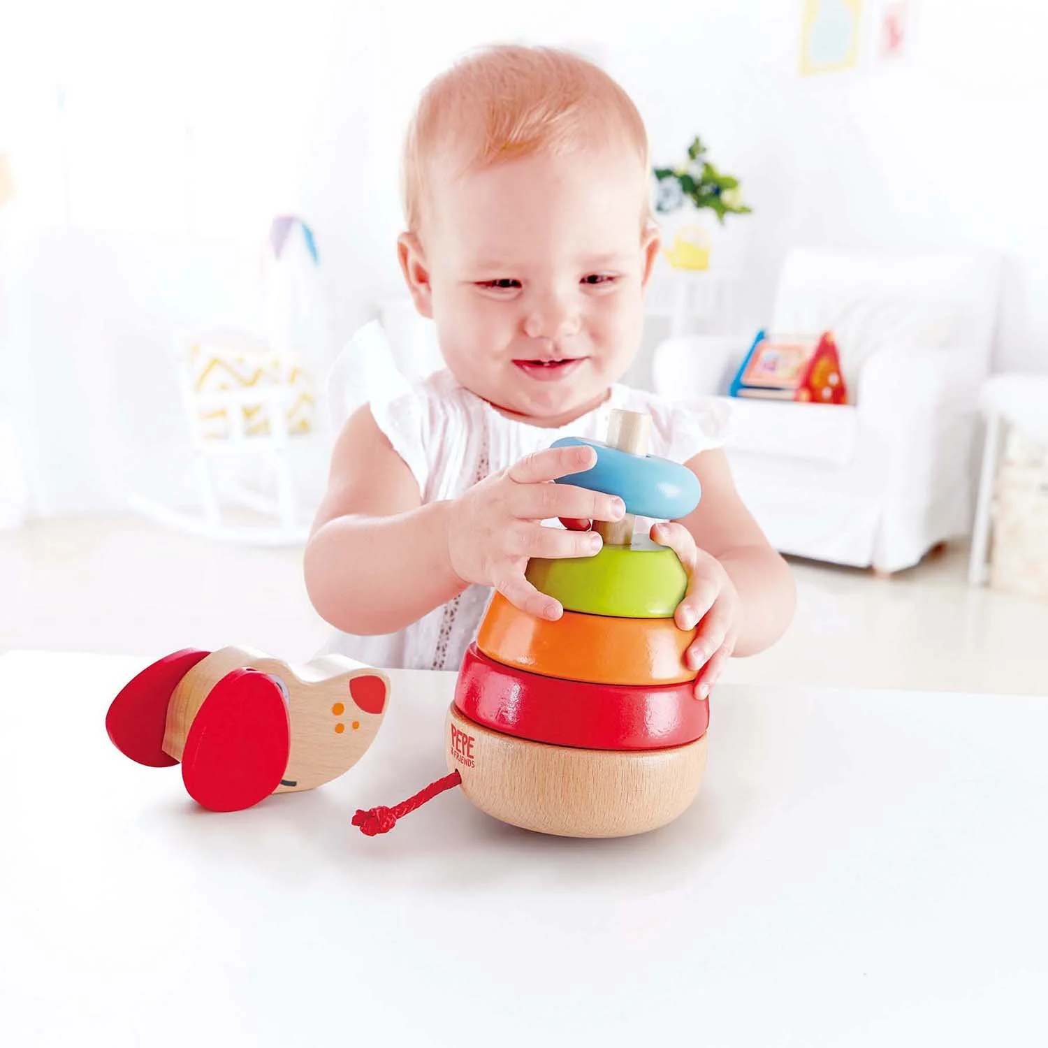 Деревянная развивающая игрушка Пирамидка Щенок Hape foto