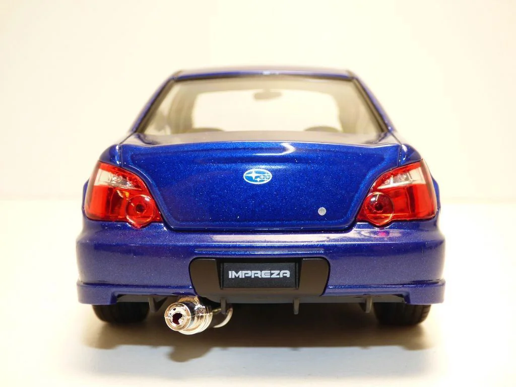 Машина Welly Subaru Impreza, 1:24