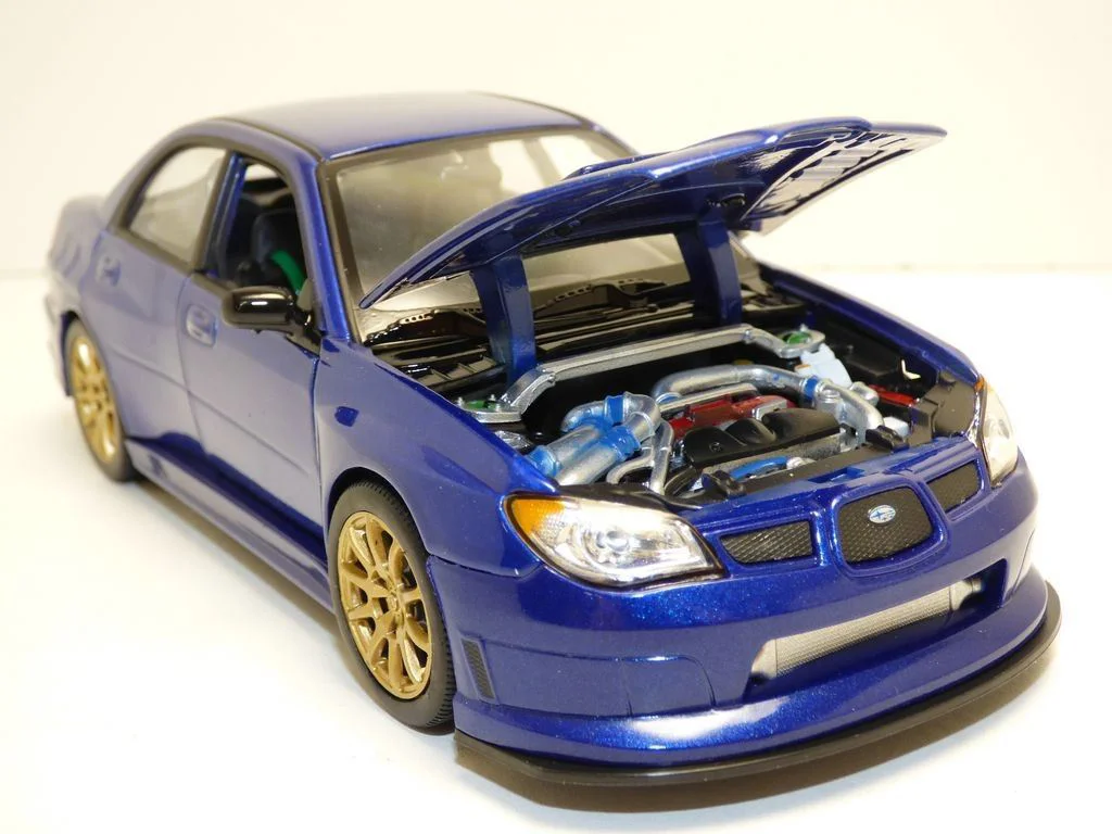 Машина Welly Subaru Impreza, 1:24